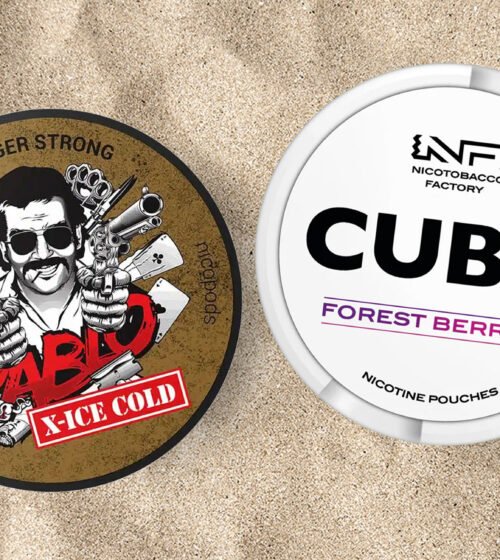 Boites de snus Pablo et Cuba posées sur le sable